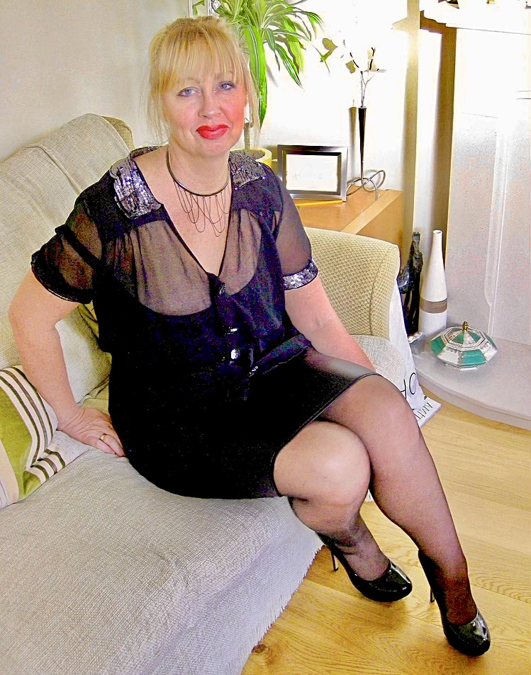 Swinger Sex Slut Wearing a Very Tight Short Shiny Slutty Knee Length Skirt and Shiny Nylon Stockings