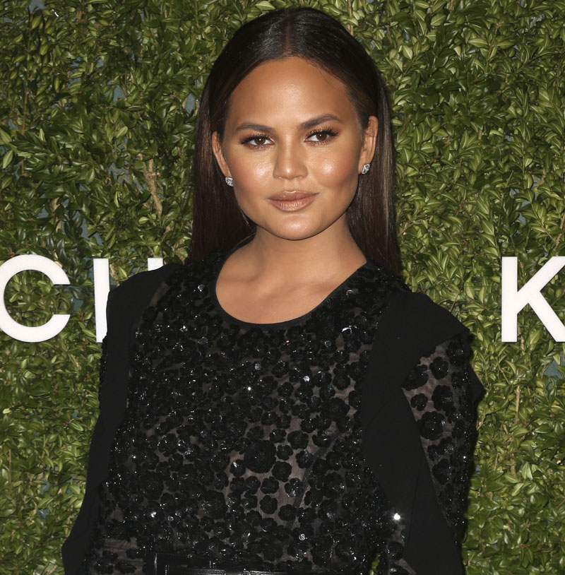 Chrissy Teigen Braless in See Through Black Blouse