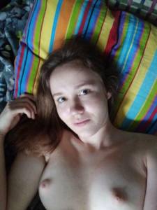 Cute brunette on the bed