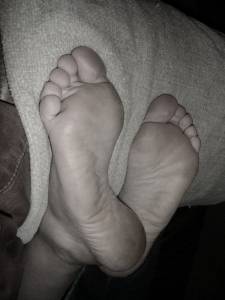 barefoot covid masked girl executes tied sith by stomping his balls with soles .