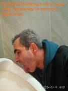 Humiliated fagot Oleg obediently licks the urinal.
