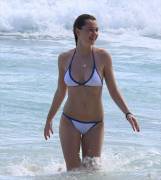 Immy Waterhouse Frolics in the Surf in a Wet White Bikini