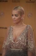 Rita Ora Braless in See Through Lace Dress