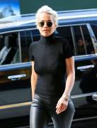 Rita Ora Pokies in Slightly See Through Top
